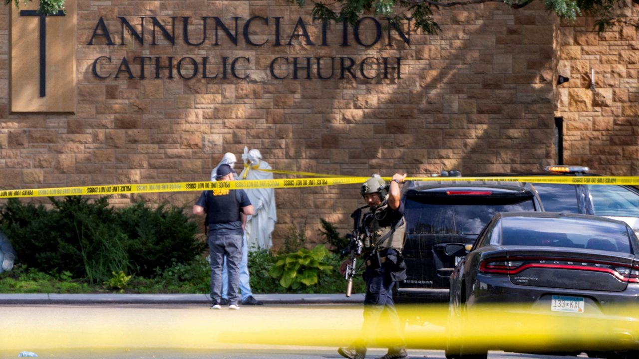 Law enforcement officers set up barriers after a shooting at Annunciation Church, which is also home to an elementary school, in Minneapolis, Minnesota, U.S. August 27, 2025. REUTERS/Ben Brewer