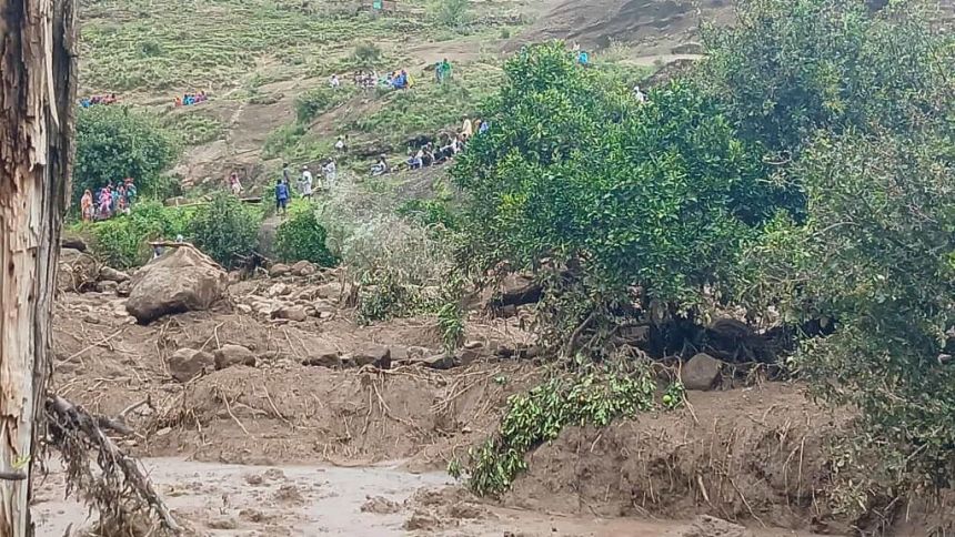 People gather after a landslide destroys the village of Thalasin in Sudan's Mara Mountains region.