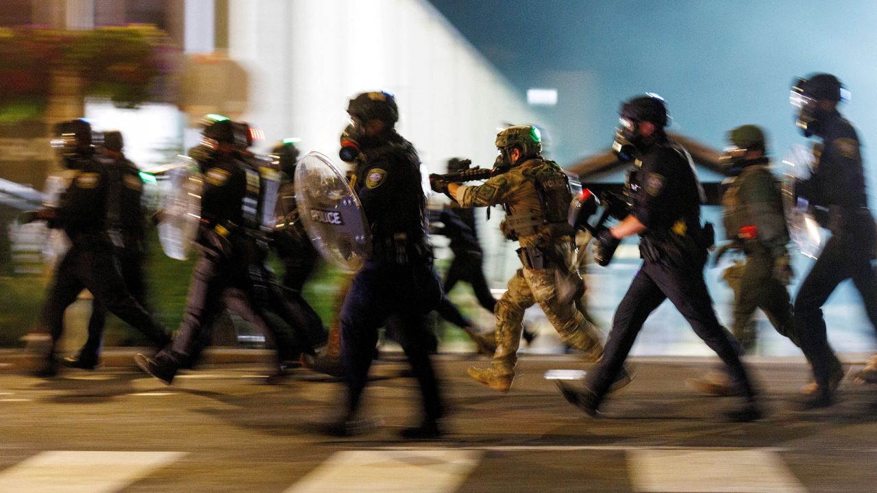 ICE agents charge towards protesters during a protest against the U.S. President Donald Trump administration's immigration policies, outside an ICE detention facility in Portland, Oregon, U.S., September 1, 2025.