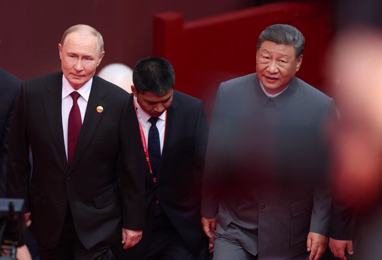 Russian President Vladimir Putin and Chinese President Xi Jinping arrive for a military parade marking the 80th anniversary of the end of World War Two in Beijing, China, on Wednesday.
