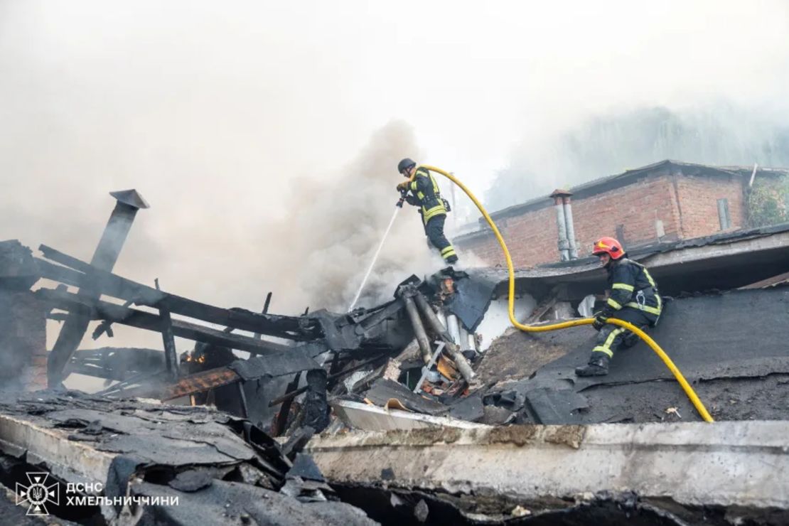 Firefighters work at a site attacked with Russian drones and missiles in Khmelnytskyi, Ukraine, on Wednesday.