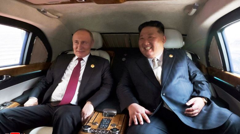 Russian President Vladimir Putin and North Korean leader Kim Jong Un sit in a vehicle during their visit to Beijing to attend China's commemoration of the 80th anniversary of the end of World War Two, in Beijing on September 3, 2025.