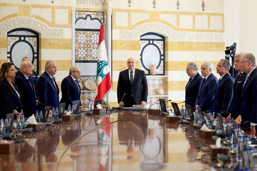 Lebanese President Joseph Aoun, Prime Minister Nawaf Salam and members of the cabinet stand as they attend a cabinet session to discuss the army's plan to disarm Hezbollah, at the Presidential Palace in Baabda, Lebanon, September 5, 2025. REUTERS/Mohamed Azakir
