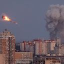 Ukrainian servicemen shoot down a Russian missile as smoke rises from the city during a Russian missile strike, amid Russia's attack on Ukraine, in Kyiv, Ukraine September 7, 2025. REUTERS/Gleb Garanich