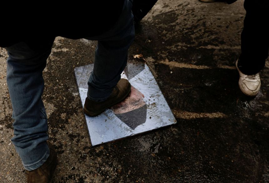 Step, demonstrator of the portrait of Prime Minister Sharmaori during his protest in Kathmandu, Nepal on September 9th.