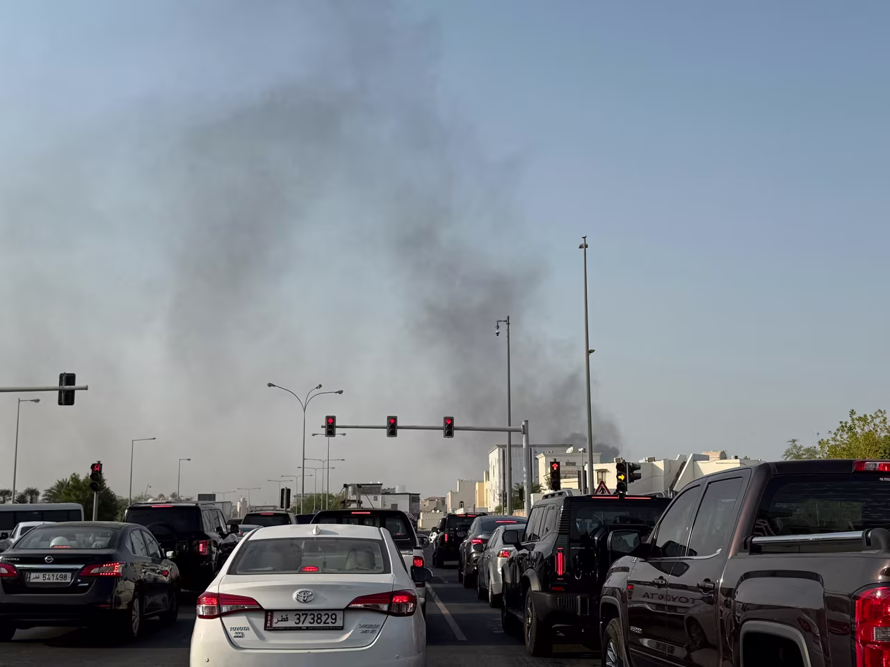 Smoke rises after several blasts were heard in Doha, Qatar, on Tuesday.