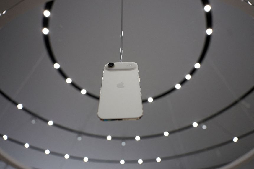 An iPhone Air hangs during an Apple's event at the Steve Jobs Theater on its campus in Cupertino, California, on September 9, 2025.
