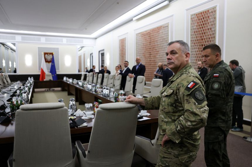 General Vislo Kukra, chief of the Polish military's general staff, arrives for an extraordinary government meeting held in Warsaw, Poland on Wednesday.