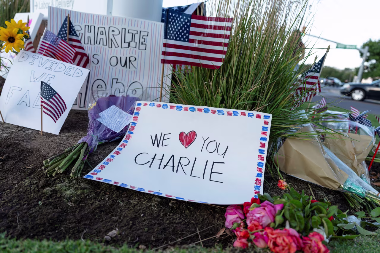 A sheet of paper commemorating Charlie Kirk is placed at a makeshift memorial outside of Timpanogos Regional Hospital, in Orem, Utah, on Thursday.