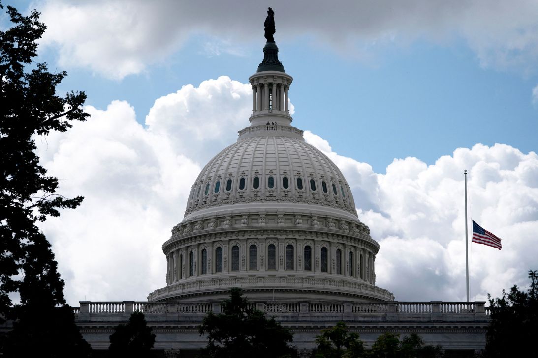 A flag at the US Capitol is lowered to half staff on Thursday, following an order by President Donald Trump.