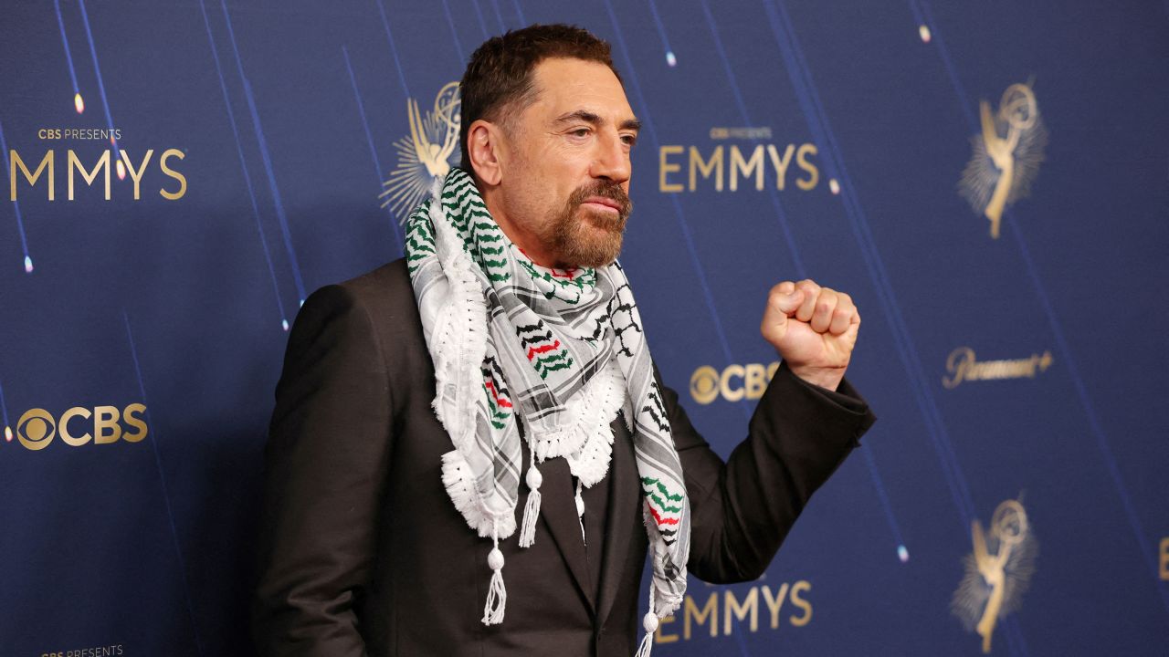 Javier Bardem wears a keffiyeh as he poses on the red carpet at the 77th Primetime Emmy Awards in Los Angeles, California, U.S., September 14, 2025.