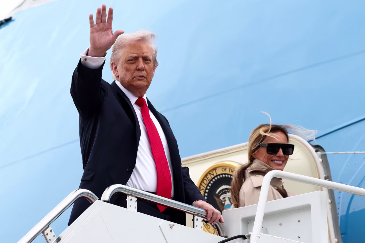 President Donald Trump and first lady Melania Trump board Air Force One as they depart for a state visit to Britain, at Joint Base Andrews, Maryland, on Tuesday.