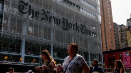 People walk by The New York Times building in Manhattan, New York City, U.S., September 16, 2025.  U.S. President Donald Trump has filed a $15 billion defamation lawsuit against the New York Times and book publisher Penguin Random House. REUTERS/Kylie Cooper