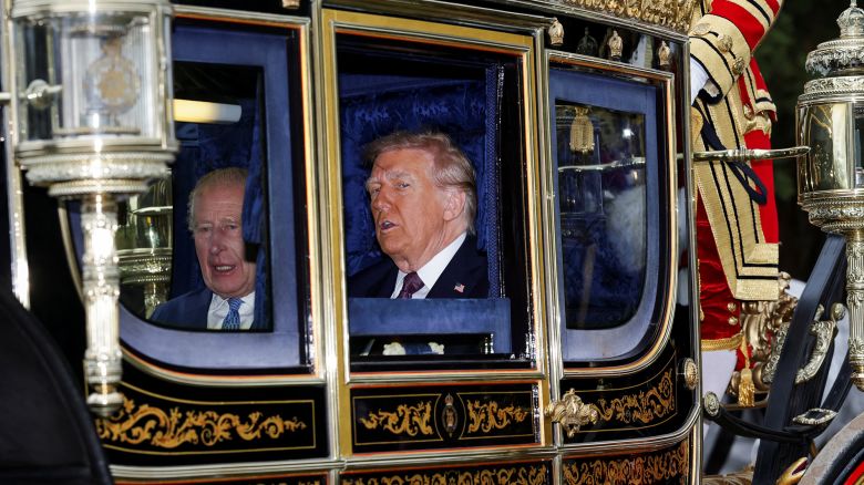 Britain's King Charles and U.S. President Donald Trump sit in a carriage during a procession through Windsor Castle, in Windsor, Britain, September 17, 2025. REUTERS/Toby Melville/Pool