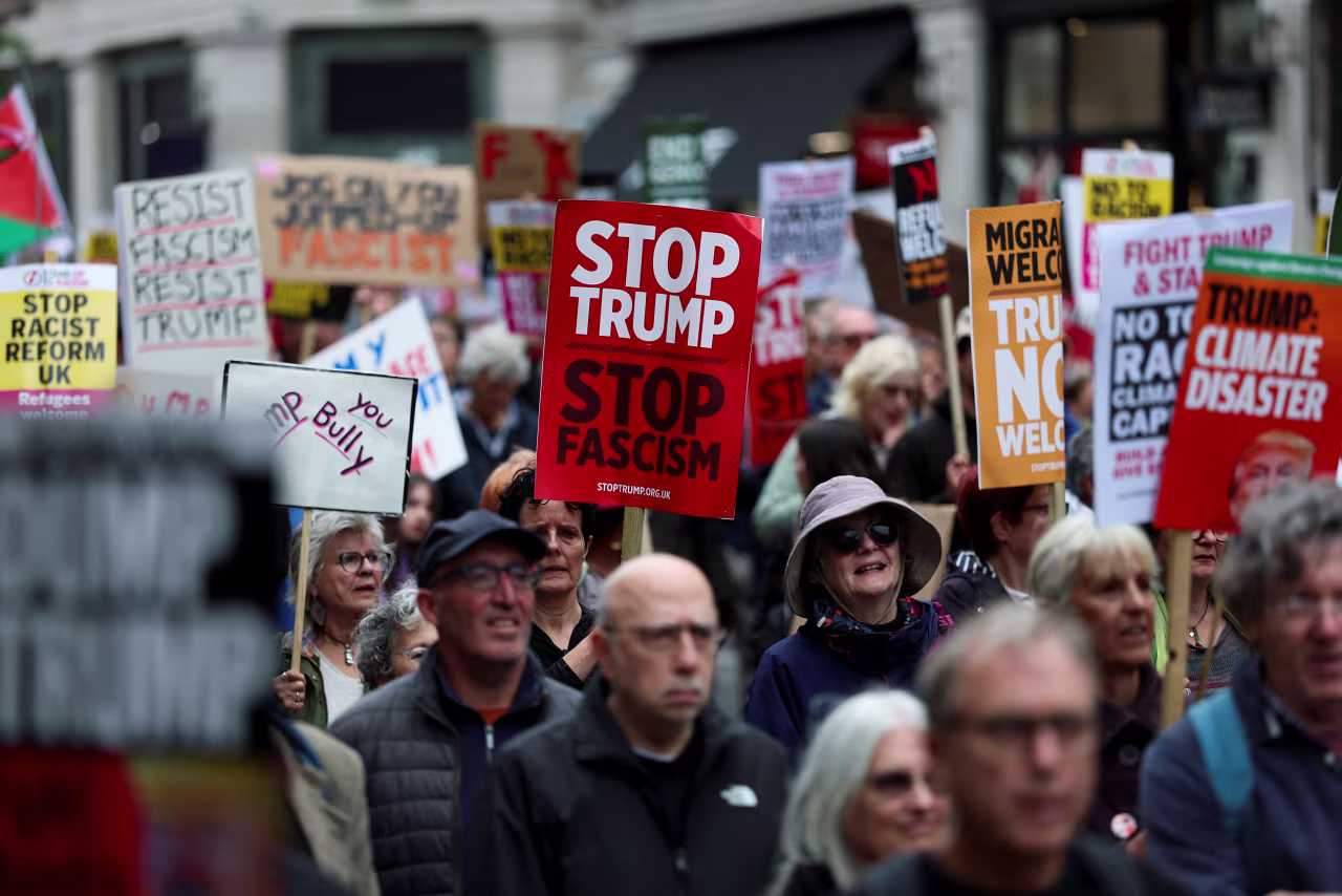 Demonstrators hold placards protesting the state visit of US President Donald Trump in London on September 17.