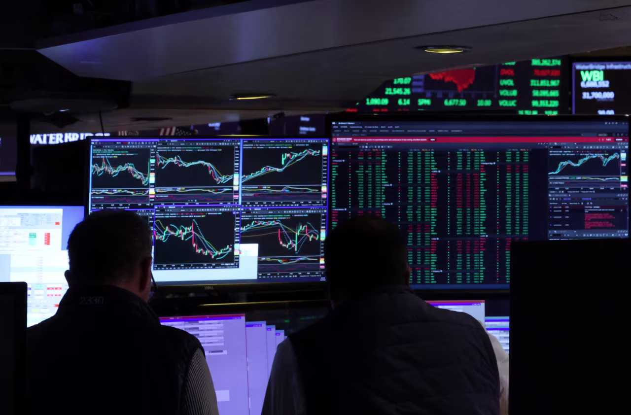 Traders work on the floor at the New York Stock Exchange on Wednesday.