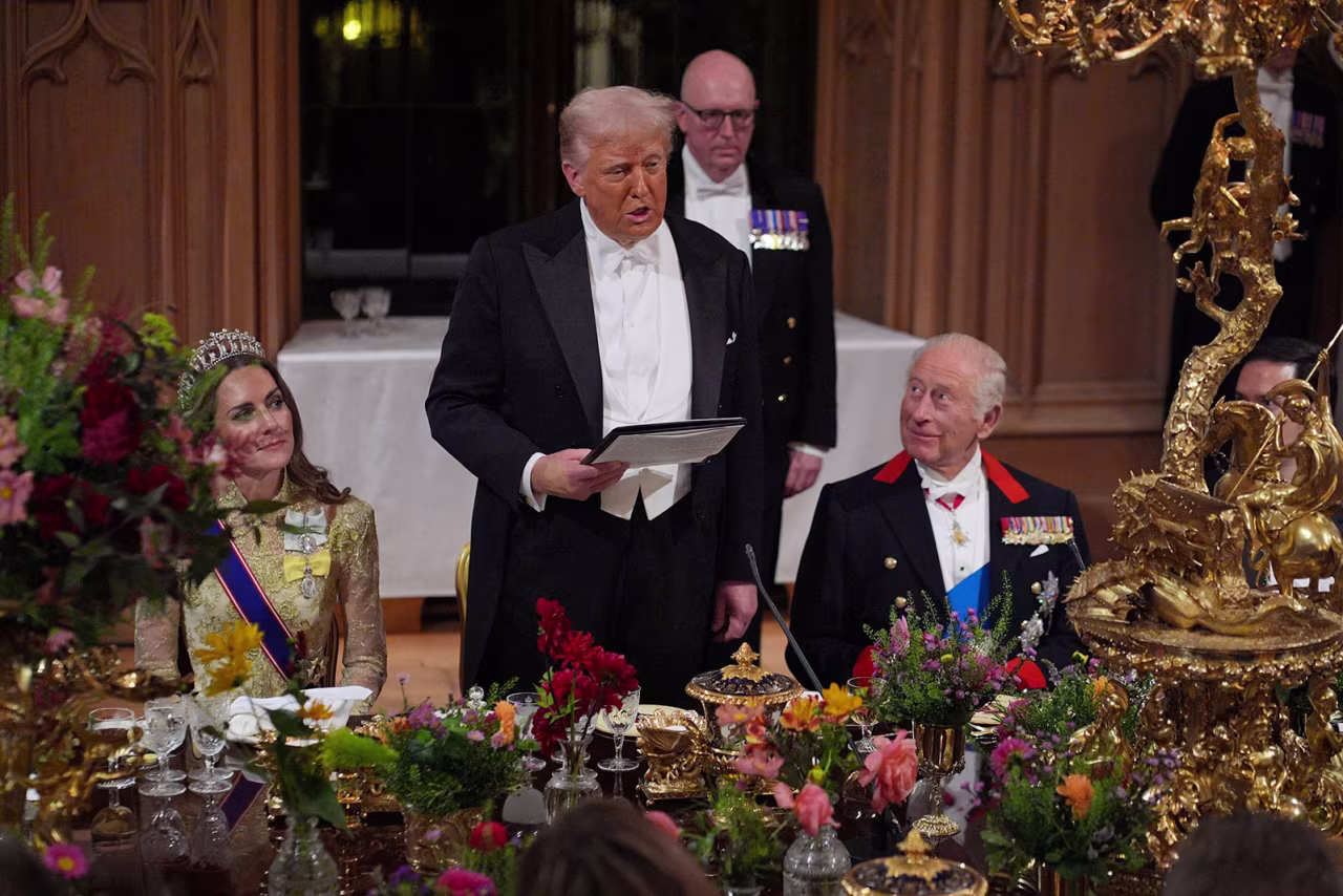 US President Donald Trump delivers his speech as King Charles III and the Princess of Wales listen.