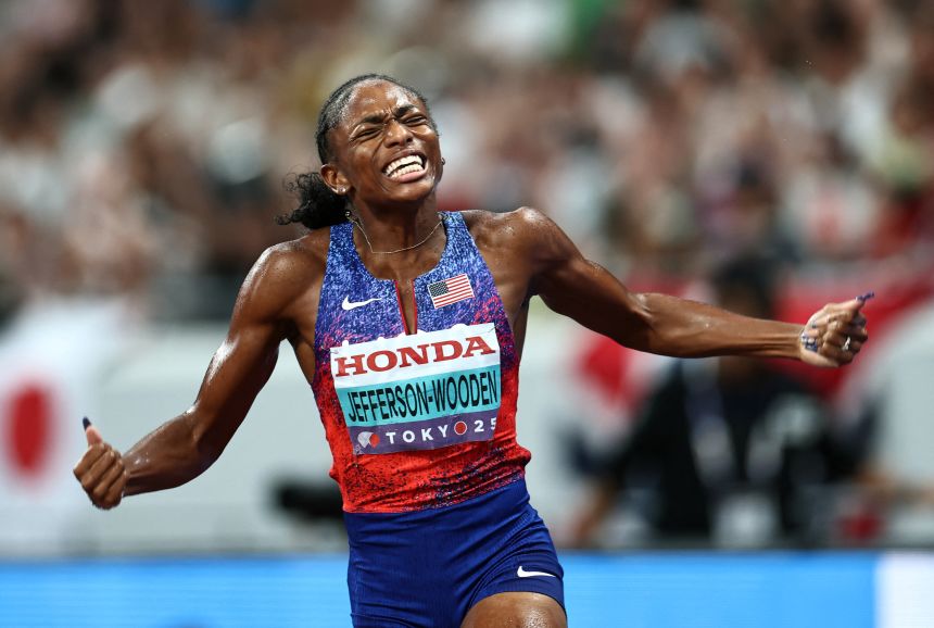 Jefferson-Wooden celebrates after winning gold in the women's 4x100m relay.
