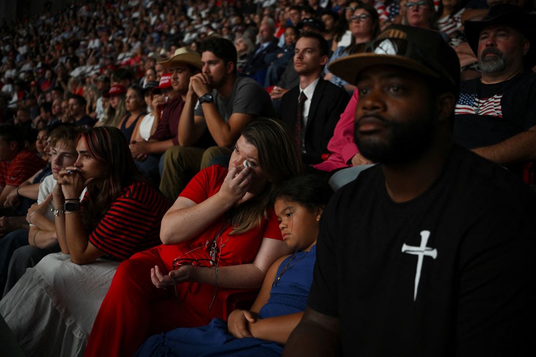 Shauna and her daughter Peyton Griggs, 7, react during Erika Kirk's speech in Glendale, Arizona, on Sunday.