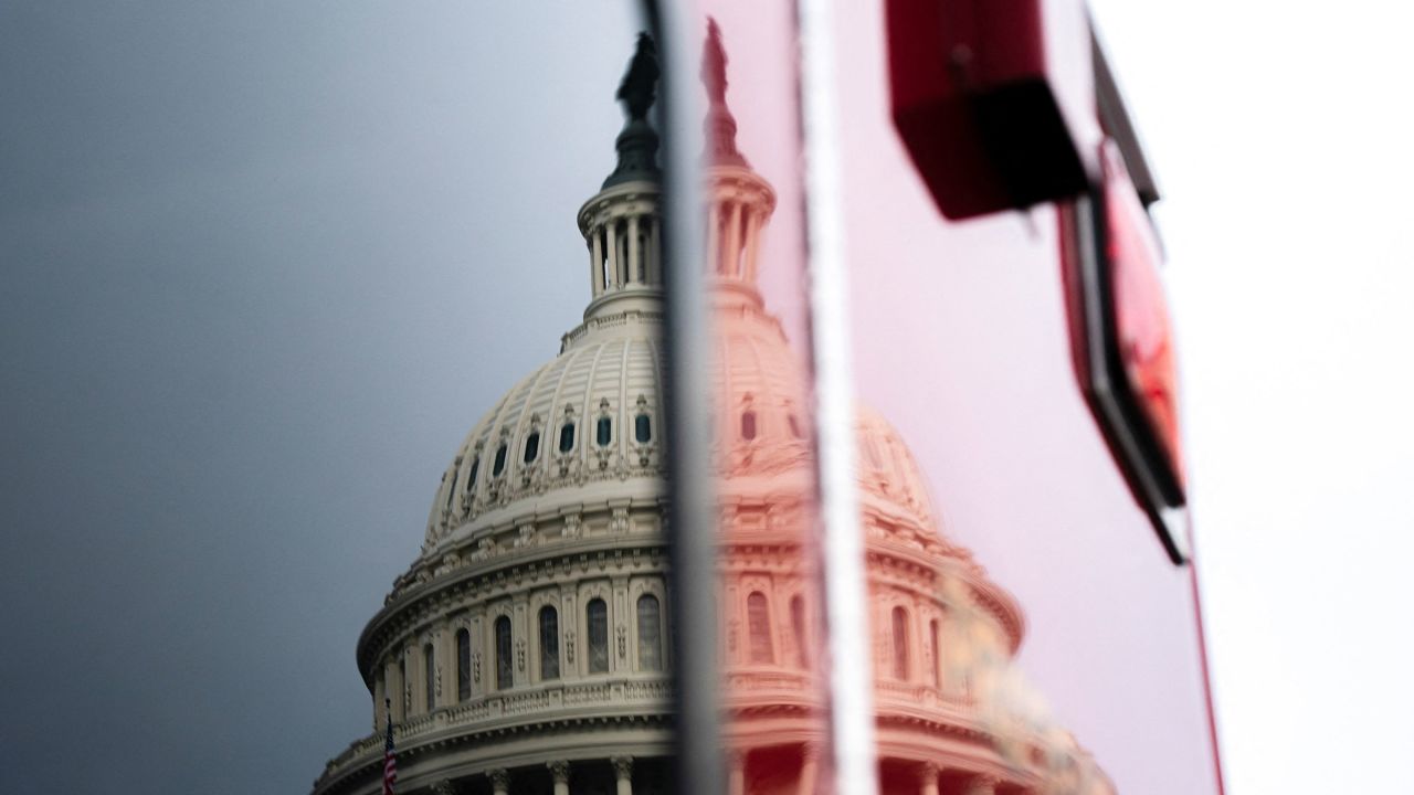 The U.S. Capitol is reflected on a surface, as a looming partial government shutdown is a week away if Congress fails to fund the government, on Capitol Hill in Washington, D.C., U.S., September 24, 2025. REUTERS/Nathan Howard  