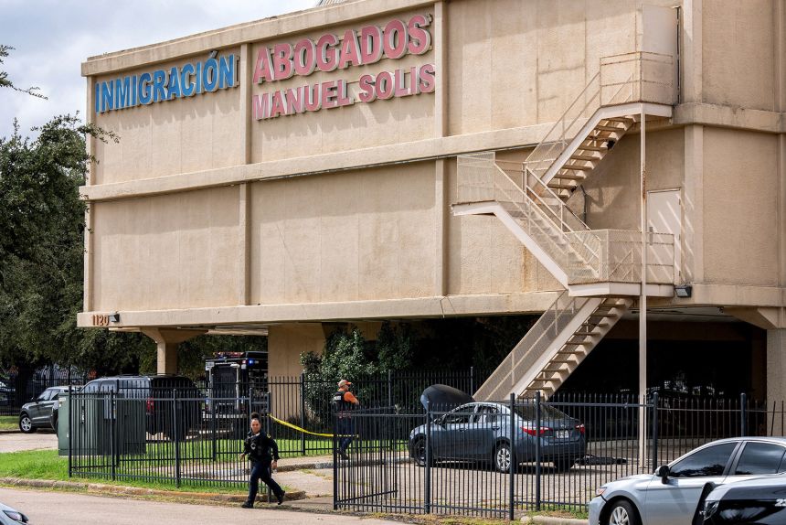 Law enforcement personnel respond at the scene of a shooting at an Immigration and Customs Enforcement field office in Dallas, Texas, on September 24.