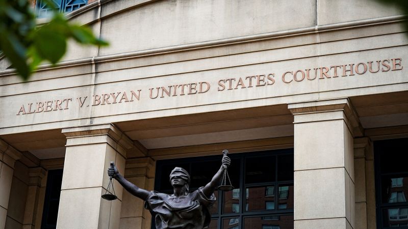 Fired federal prosecutor tapes a note about duty to the door on his way out