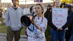 Democratic congressional candidate Kat Abughazaleh holds a megaphone outside of the Broadview ICE processing facility, after U.S. President Donald Trump ordered increased federal law enforcement presence to assist in crime prevention, in Broadview, Illinois, U.S. September 26, 2025. REUTERS/Jim Vondruska