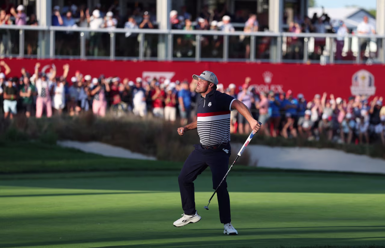 Bryson DeChambeau celebrates after winning the 17th hole.