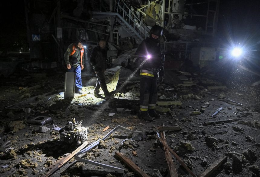 A rescuer looks at the engine of Russian drone as he works at the site of a Russian drone strike, amid Russia's attack on Ukraine, in Zaporizhzhia, Ukraine on September 27, 2025.