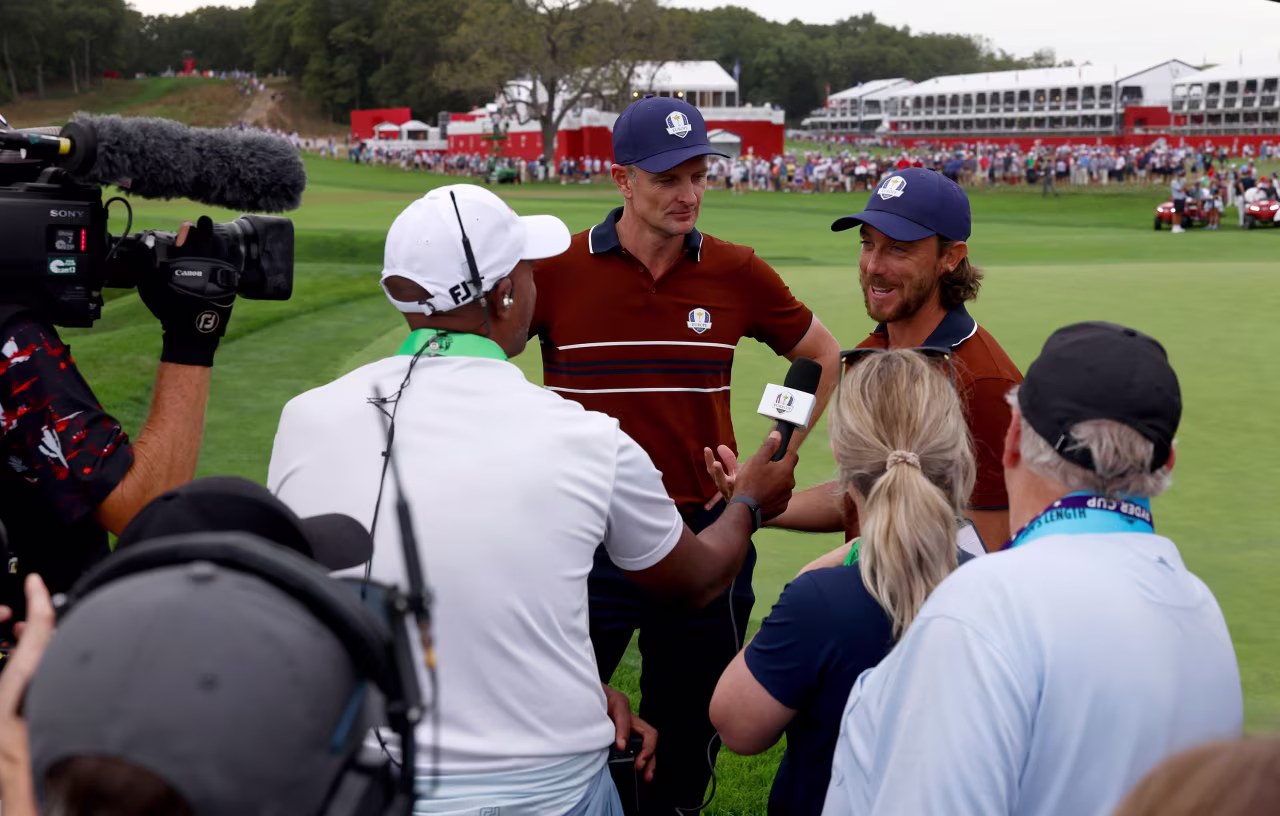 Justin Rose and Tommy Fleetwood are interviewed after winning their match.