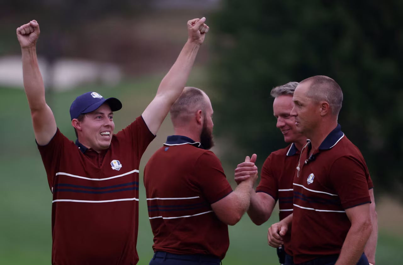 Matt Fitzpatrick celebrates after winning the match on the 18th hole.