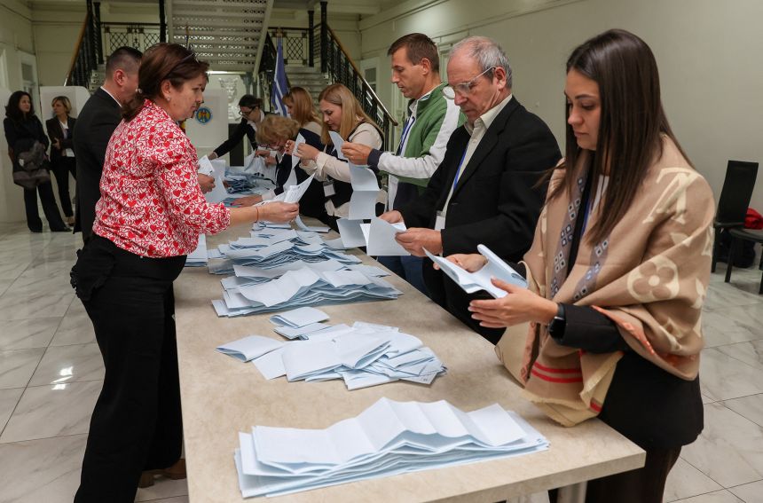 Members of an electoral commission count ballots after polling stations closed in Moldova's parliamentary elections in Chisinau, Moldova, on Sunday.