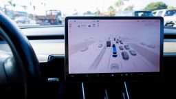 A Tesla Model 3 vehicle drives using FSD (Full Self-Driving) in California.