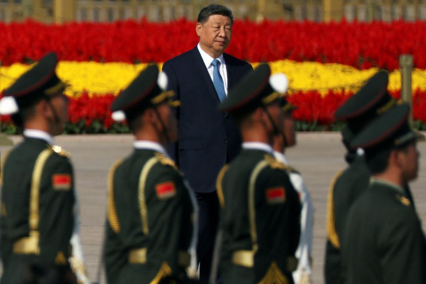 Chinese leader Xi Jinping arrives for a ceremony to mark Martyrs' Day in Beijing's Tiananmen Square on September 30.