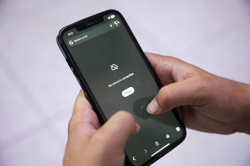 A man tries to use Google on his smartphone in Kabul, Afghanistan, on Tuesday.