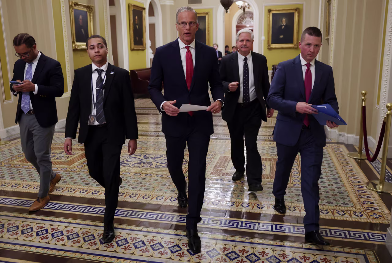 Senate Majority Leader John Thune leaves after a news conference following a Senate vote, hours before a partial government shutdown is set to take effect.