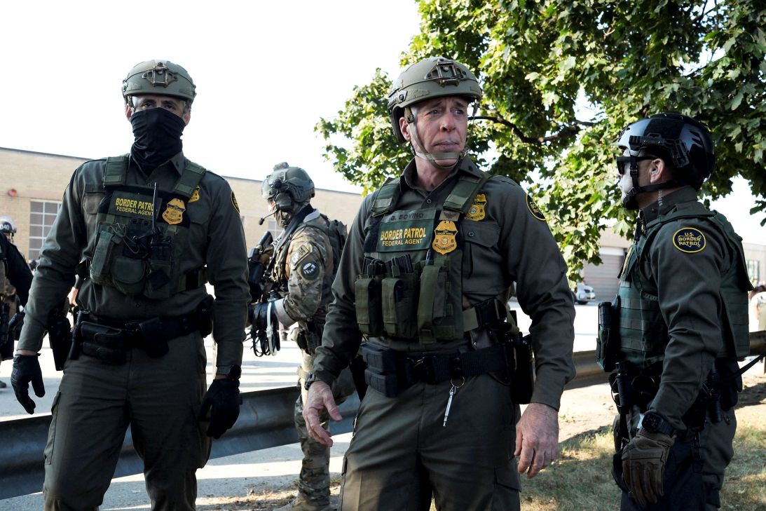 US Border Patrol Chief Greg Bovino, center, stands with other Border Patrol agents outside the ICE facility in Broadview, Illinois, on October 3.