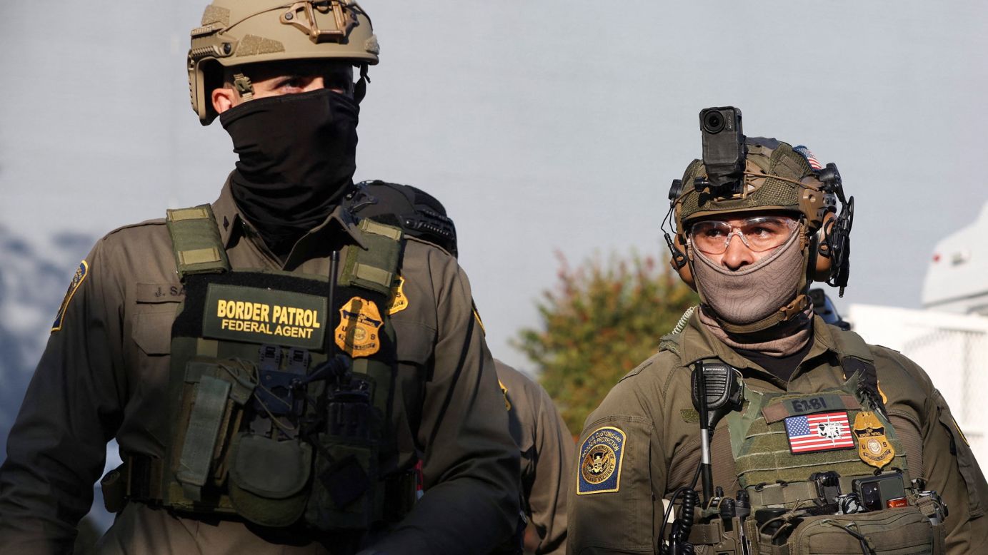 Border Patrol Federal Agents, one of whom wears a camera on his helmet, operate outside the US Immigration and Customs Enforcement facility in Broadview, Illinois, on October 3.