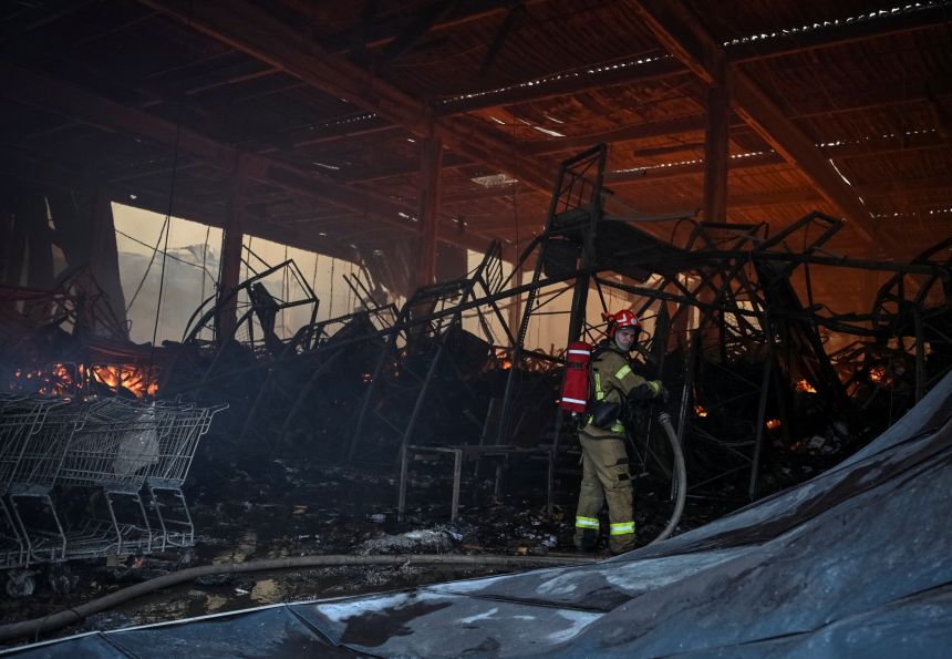 A firefighter works at the site of a Russian drone and missile strikes, amid Russia's attack on Ukraine, in Lviv, Ukraine today.