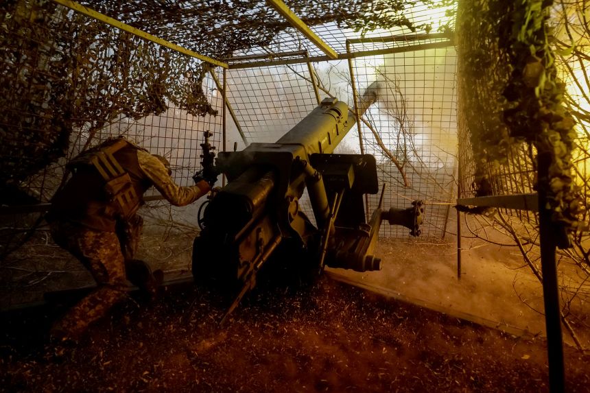 A serviceman of the 115th Separate Mechanized Brigade of the Ukrainian Armed Forces fires a D-30 howitzer towards Russian troops near the front line town of Kupiansk on October 4.