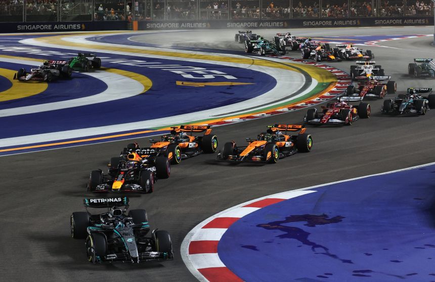 Mercedes' George Russell, Red Bull's Max Verstappen, McLaren's Oscar Piastri and McLaren's Lando Norris in action during the race.