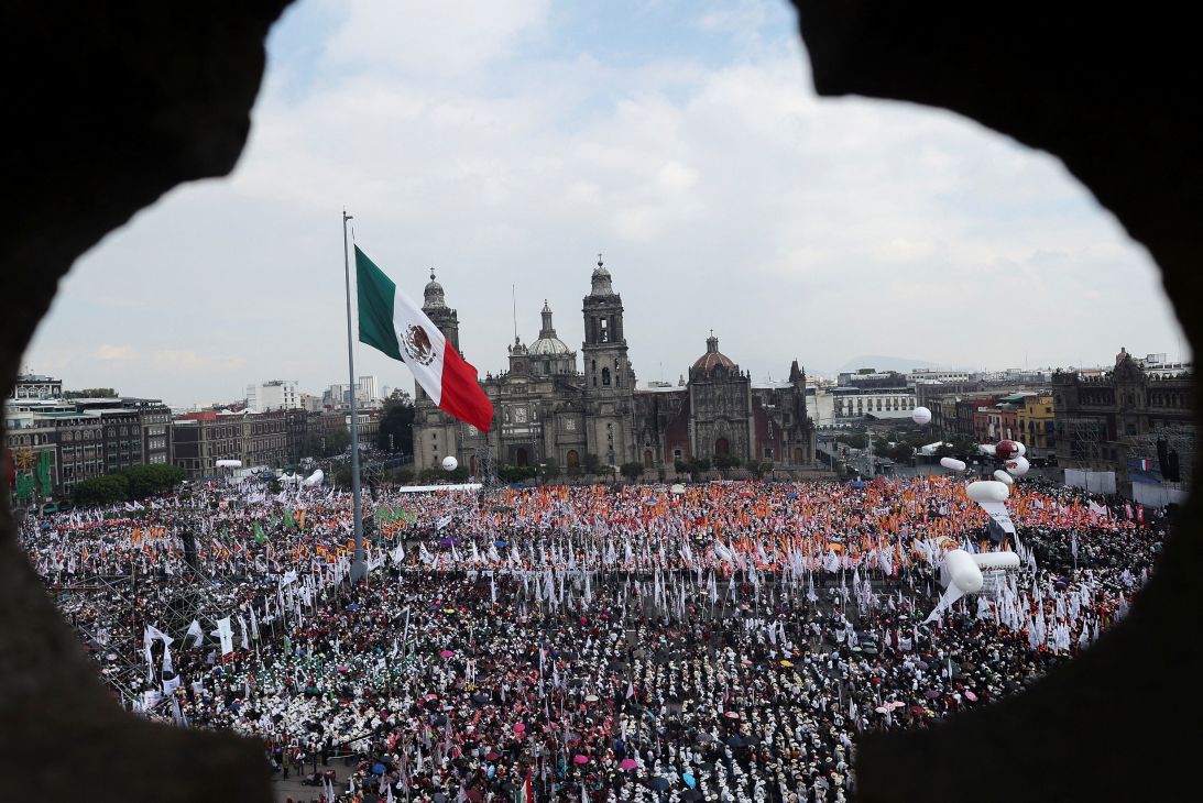 People gather at Zocalo Square to attend an event marking Mexico's President Claudia Sheinbaum's first year in office in Mexico City on Sunday.