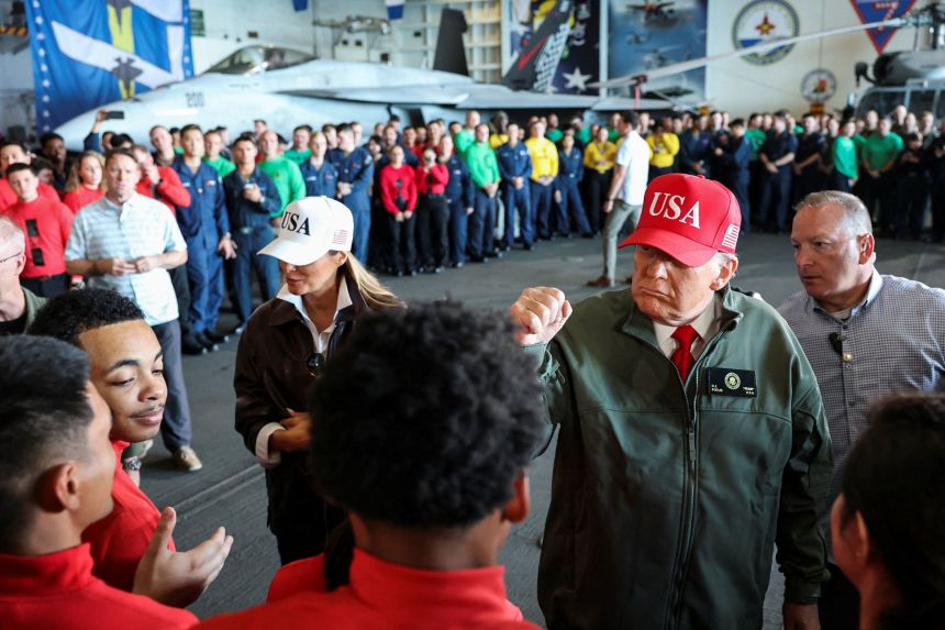 President Donald Trump and first lady Melania Trump visit the aircraft carrier USS George H.W. Bush, off the coast of Norfolk, Virginia, October 5, 2025.