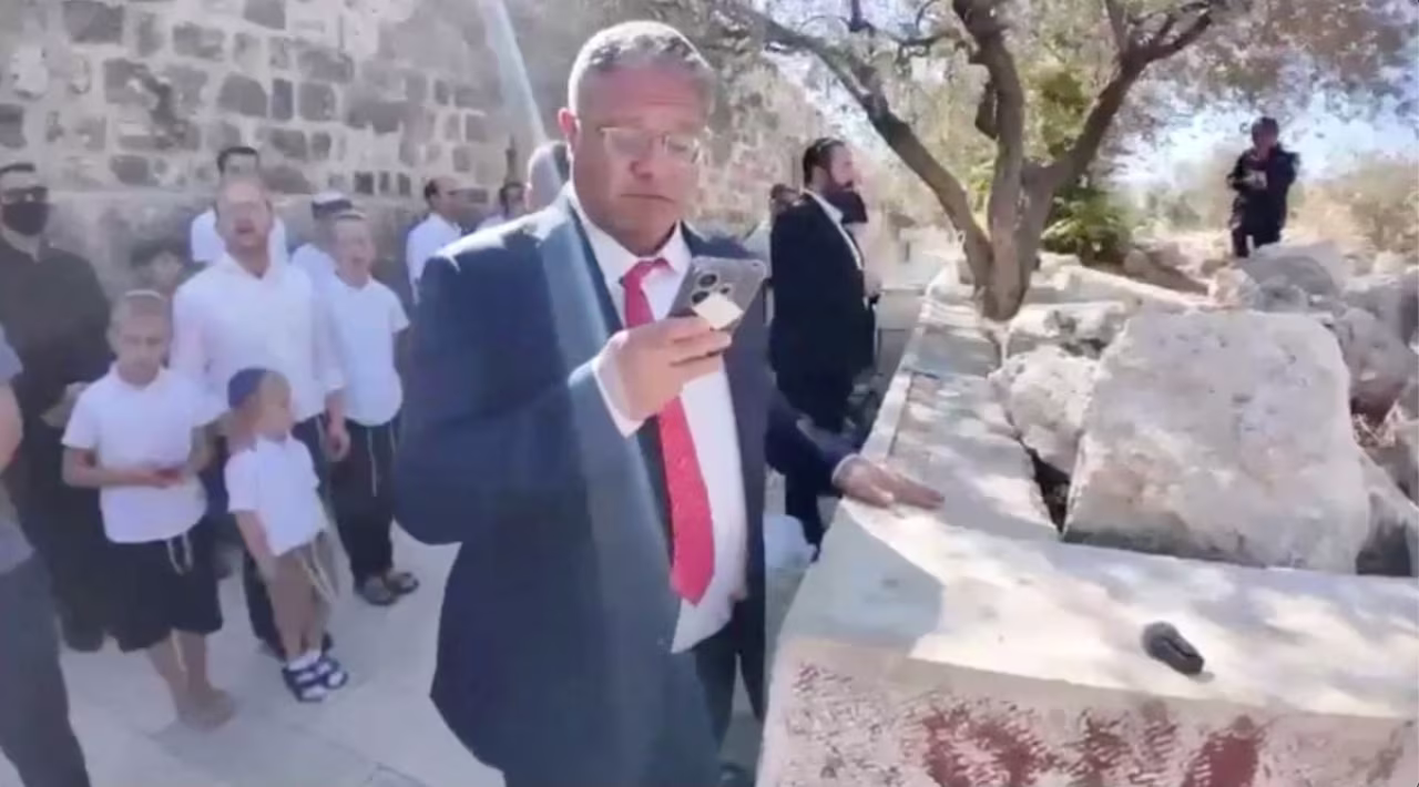 Israeli National Security Minister Itamar Ben-Gvir prays at the Al-Aqsa Mosque compound during the Jewish holiday of Sukkot, in this screengrab from a video obtained on Wednesday.