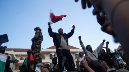 Protesters cheer atop Madagascar military vehicle during a nationwide youth-led protest over frequent power outages and water shortages, in Antananarivo, Madagascar on October 11, 2025.