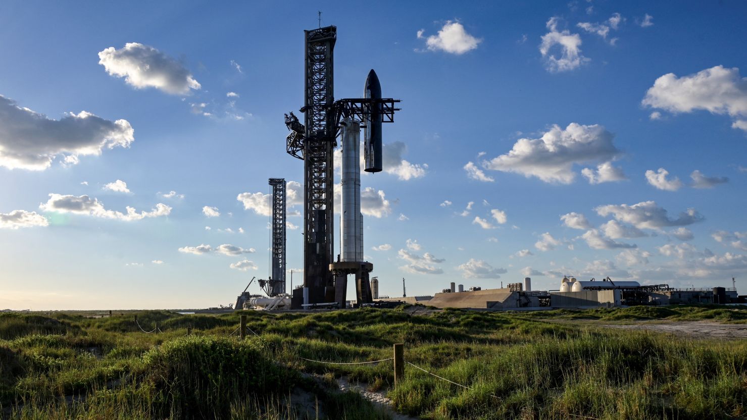 The SpaceX Starship spacecraft is hoisted along the launch tower on October 11 for stacking atop the Super Heavy booster in preparation for its 11th test flight from the company's complex in Starbase, Texas.