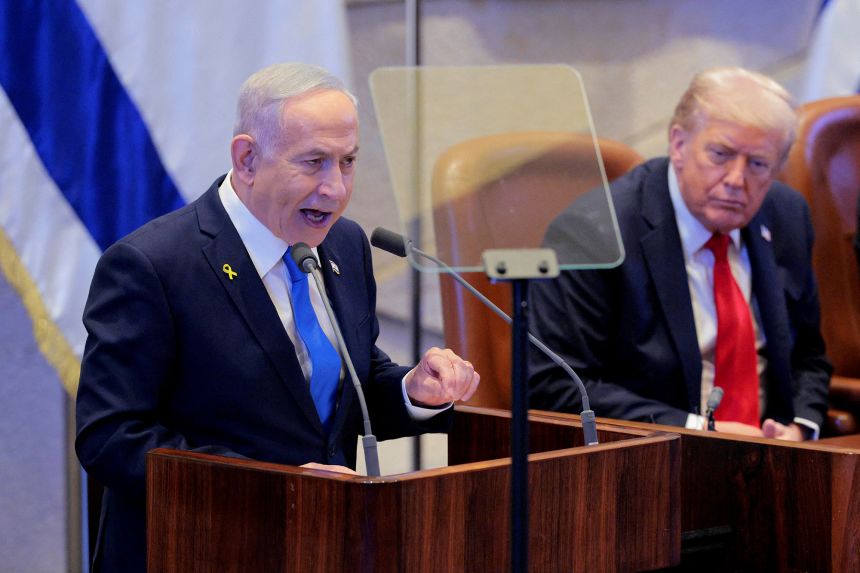 Israeli Prime Minister Benjamin Netanyahu addresses the Knesset as US President Donald Trump looks on, in Jerusalem on Monday.