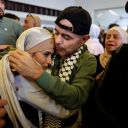 A freed Palestinian is hugged by a relative after he was released from an Israeli jail as part of a hostages-prisoners swap and a ceasefire deal in Gaza between Hamas and Israel, in Ramallah, in the Israeli-occupied West Bank, October 13, 2025. REUTERS/Ammar Awad