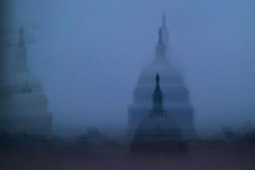 The US Capitol is reflected in glass on October 13.