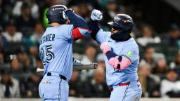 Oct 15, 2025; Seattle, Washington, USA; Toronto Blue Jays first baseman Vladimir Guerrero Jr. (27) celebrates with Toronto Blue Jays right fielder Anthony Santander (25) after hitting a solo home run during the fifth inning against the Seattle Mariners during game three of the ALCS round for the 2025 MLB playoffs at T-Mobile Park. Mandatory Credit: Steven Bisig-Imagn Images